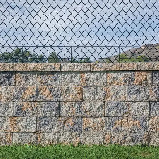 Segmental concrete block retaining wall in blended tan and gray tones